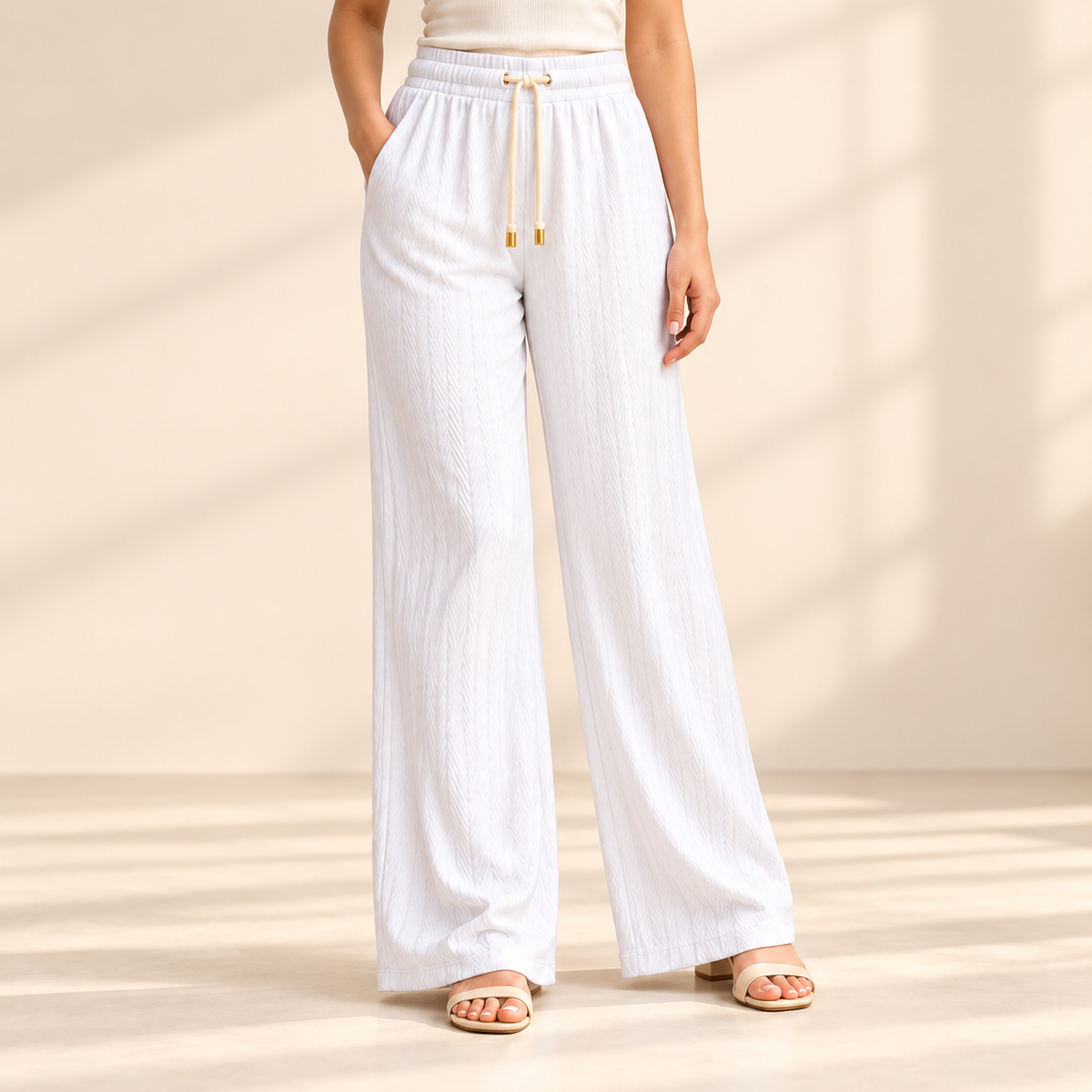 Sana Outfits frost white palazzo pants worn by model